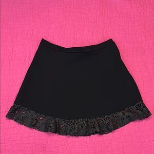 Jazmin Chebar black mini skirt with genuine leather laser cut trim, L